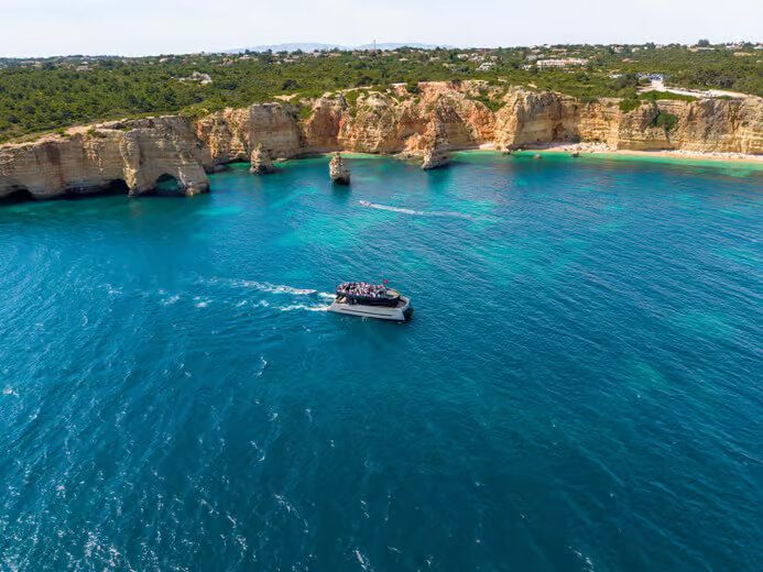 Modern catamaran cruising in Albufeira