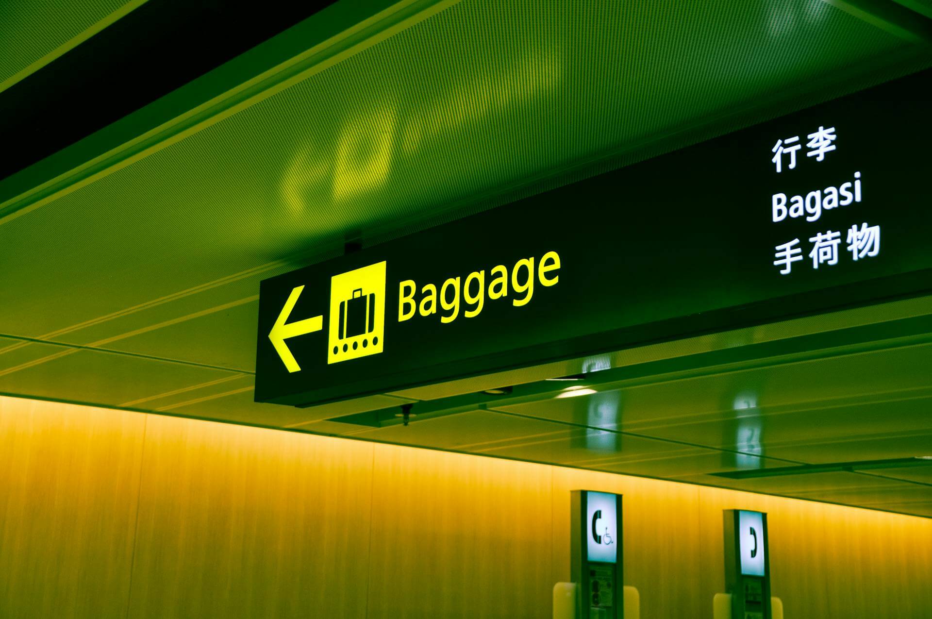 High-Quality Travel Essentials Airport sign for baggage drop