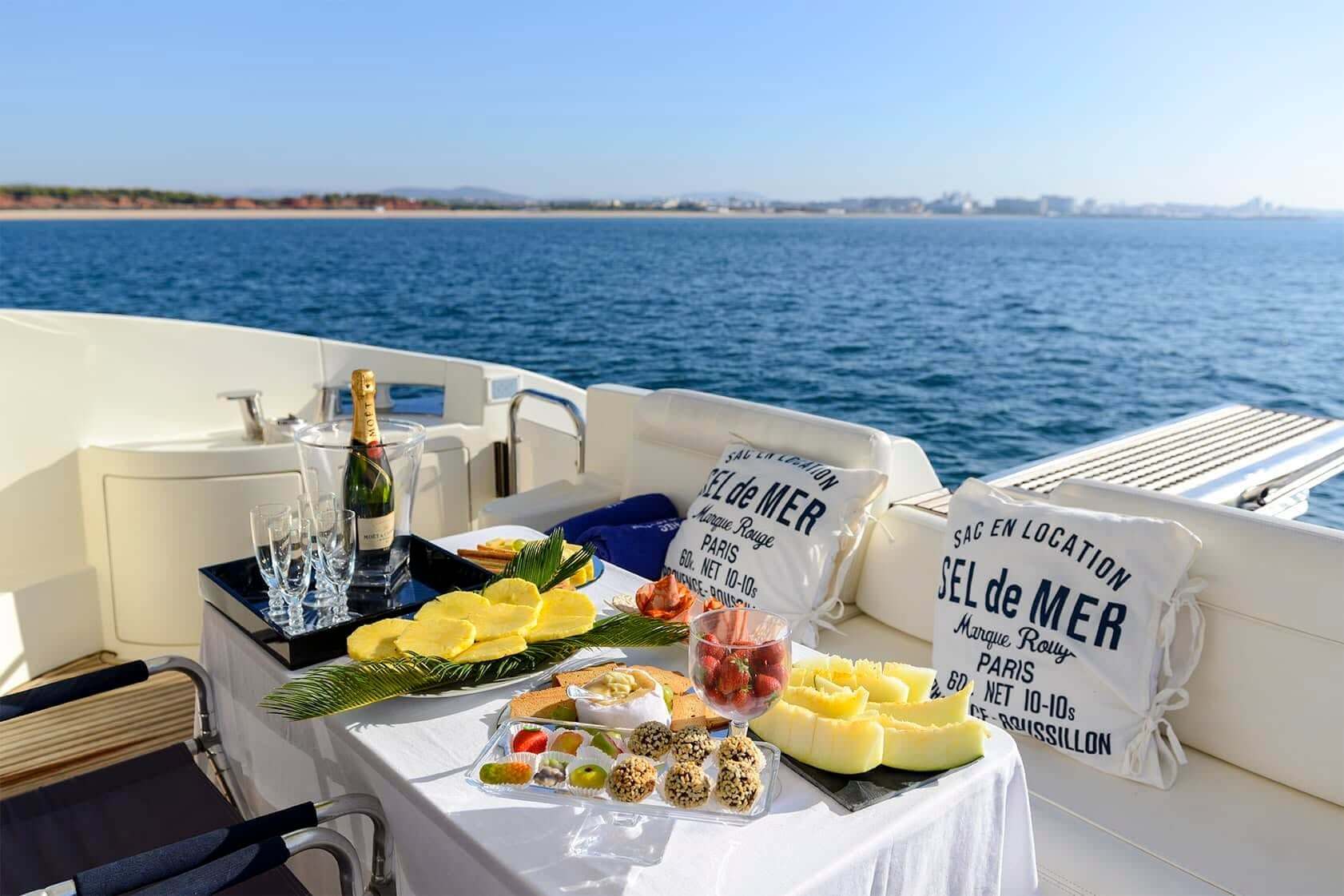 A close-up view of the modern interior and comfortable seating on a Bliss Charters luxury vessel.