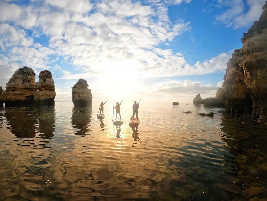 Three people on Stand up paddle boards in Lagos