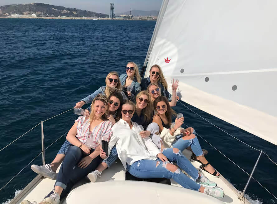 Friends on a sailing boat in Barcelona