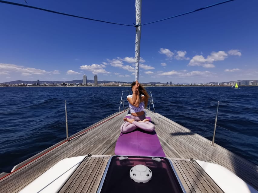 Yoga pose on sailing boat in Barcelona